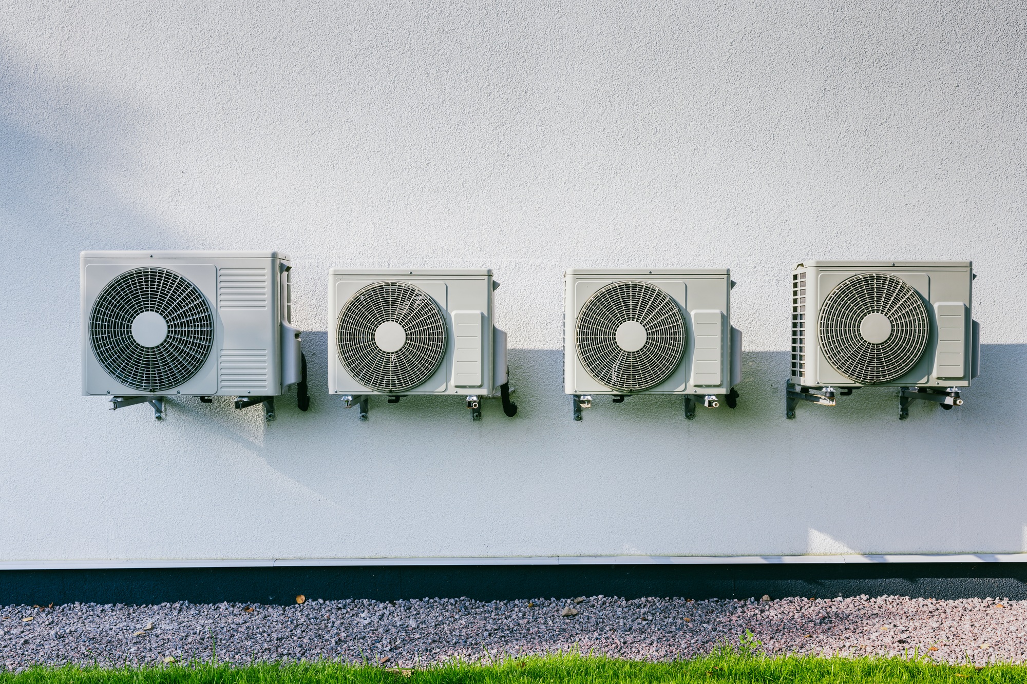 Air conditioner compressor installed in modern house. Air conditioning unit or compressor